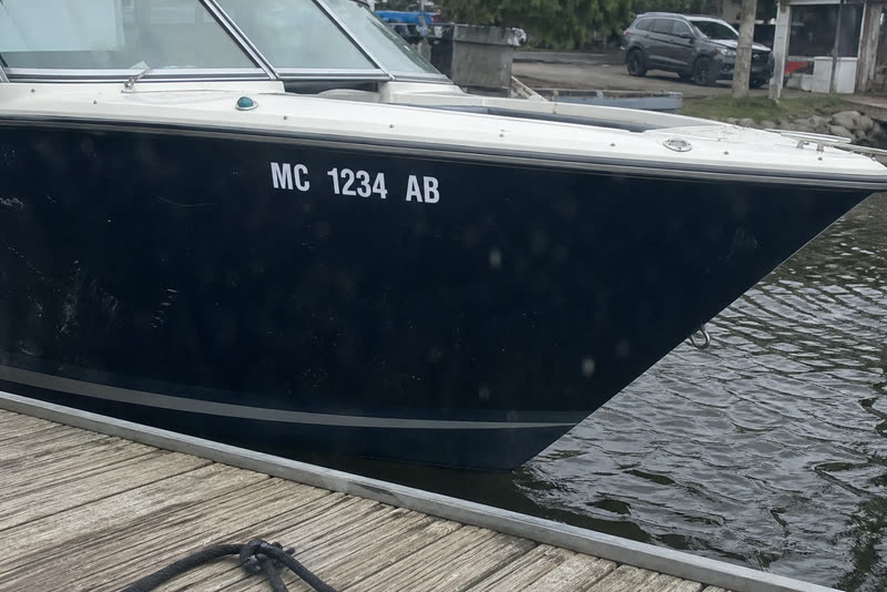 MC 1234 AB · 3" white on a navy hull. Dark hull, light vinyl - the contrast rule in one picture.