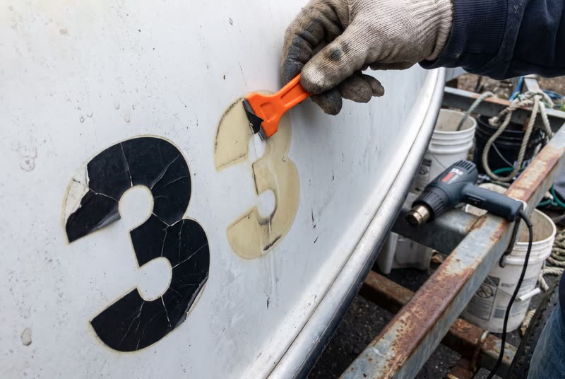 Removing old lettering. The ghost line the old set leaves behind.